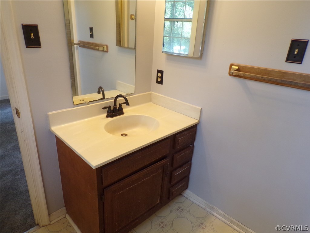 4406 Rabbit Foot Place Chesterfield, VA 23236 - Photo 17 of 21 a bathroom with a sink and a mirror