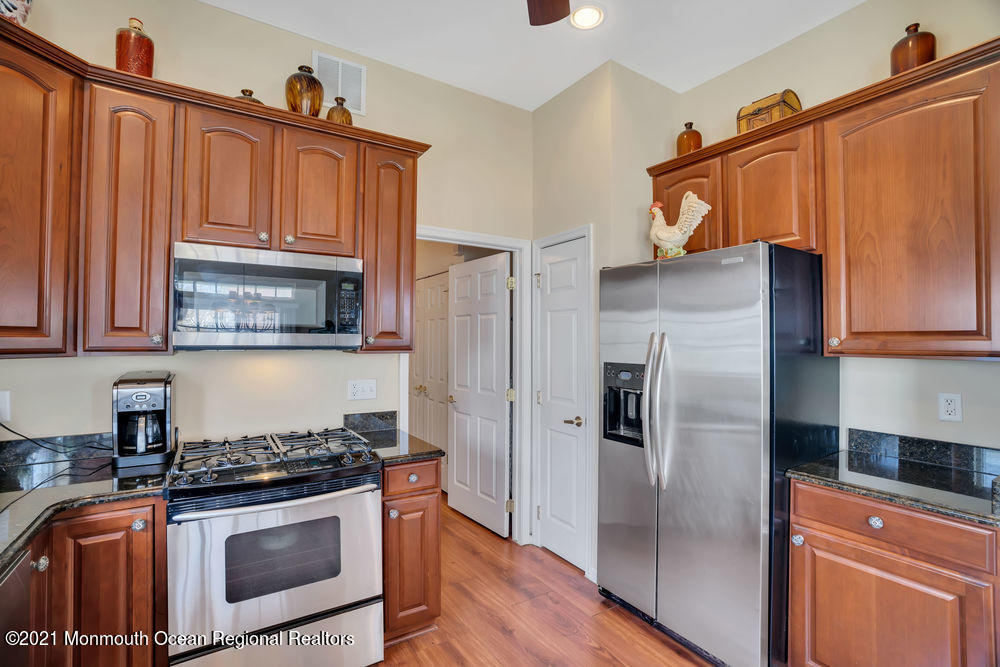 51 Pancoast Road Waretown, NJ 08758 - Photo 12 of 29 a kitchen with stainless steel appliances granite countertop a refrigerator stove and sink