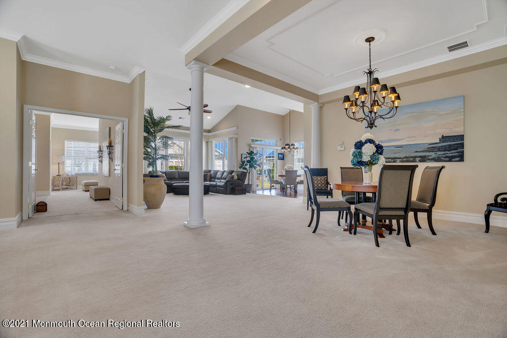 51 Pancoast Road Waretown, NJ 08758 - Photo 13 of 29 a view of a dining room with furniture and a chandelier