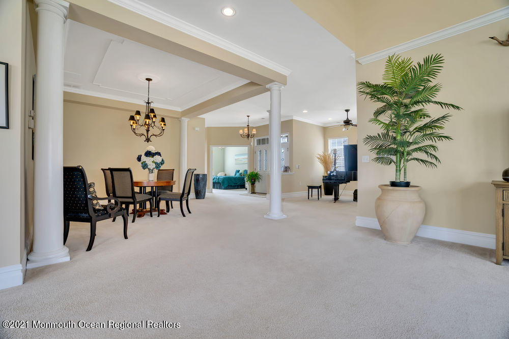 51 Pancoast Road Waretown, NJ 08758 - Photo 14 of 29 a view of a dining room with furniture and chandelier