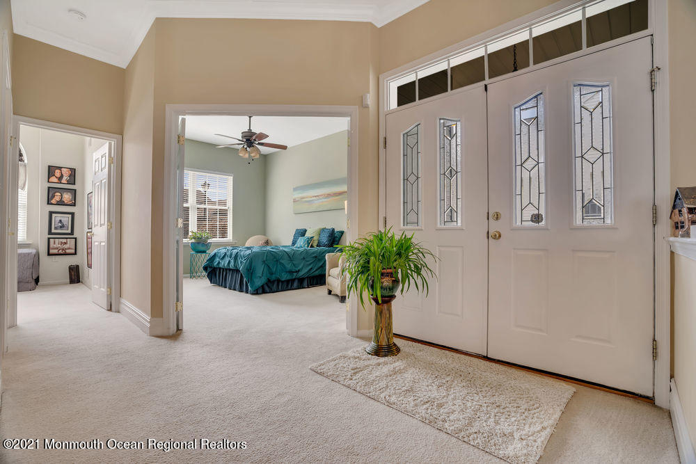 51 Pancoast Road Waretown, NJ 08758 - Photo 16 of 29 view of a hallway with potted plants in front of door