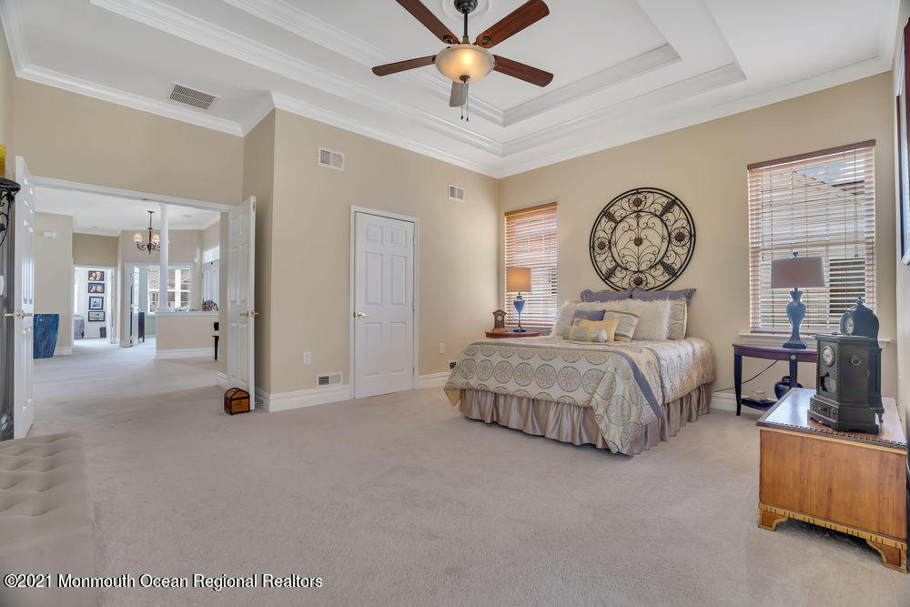 51 Pancoast Road Waretown, NJ 08758 - Photo 20 of 29 a bedroom with a bed a clock and a window