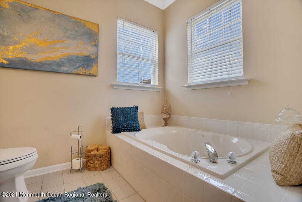 51 Pancoast Road Waretown, NJ 08758 - Photo 23 of 29 a bath tub sitting next to a white toilet