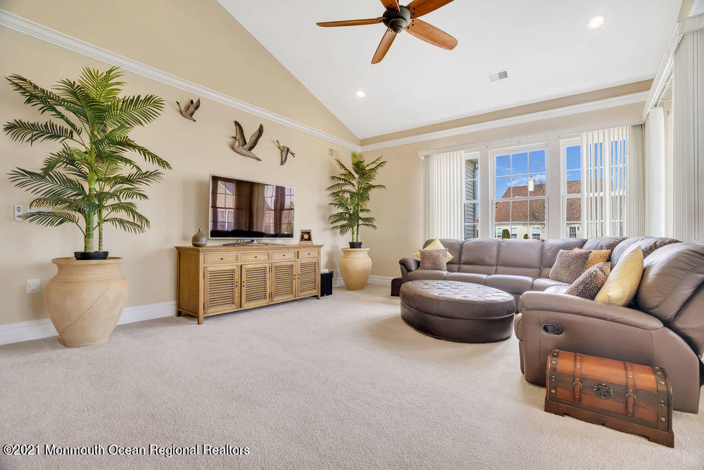 51 Pancoast Road Waretown, NJ 08758 - Photo 8 of 29 a living room with furniture and a flat screen tv