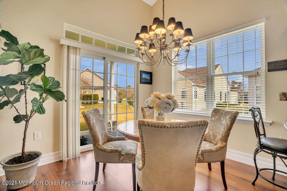 51 Pancoast Road Waretown, NJ 08758 - Photo 10 of 29 a dining room filled with furniture and chandelier