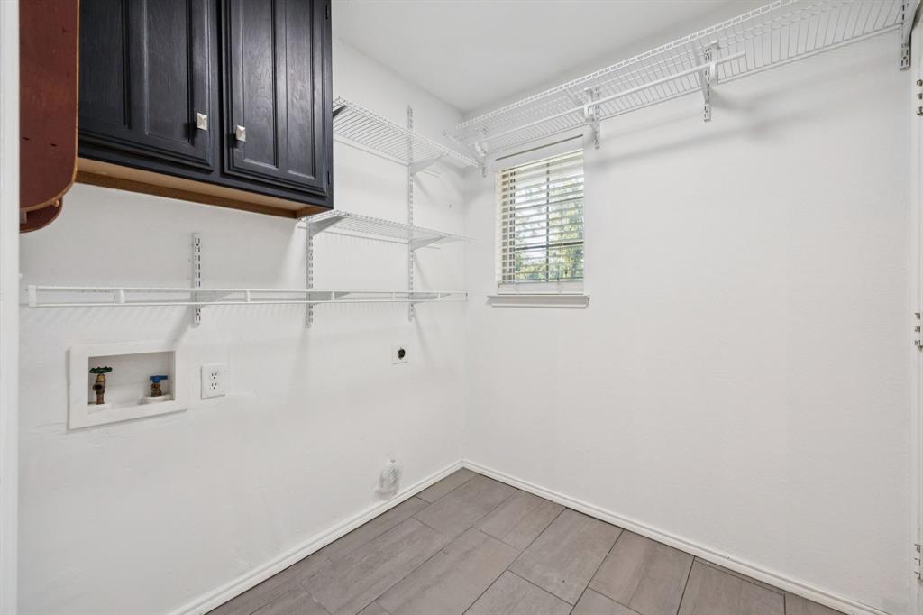3104 Emerald Street Bedford, TX 76021 - Photo 11 of 25 between garage door and kitchen