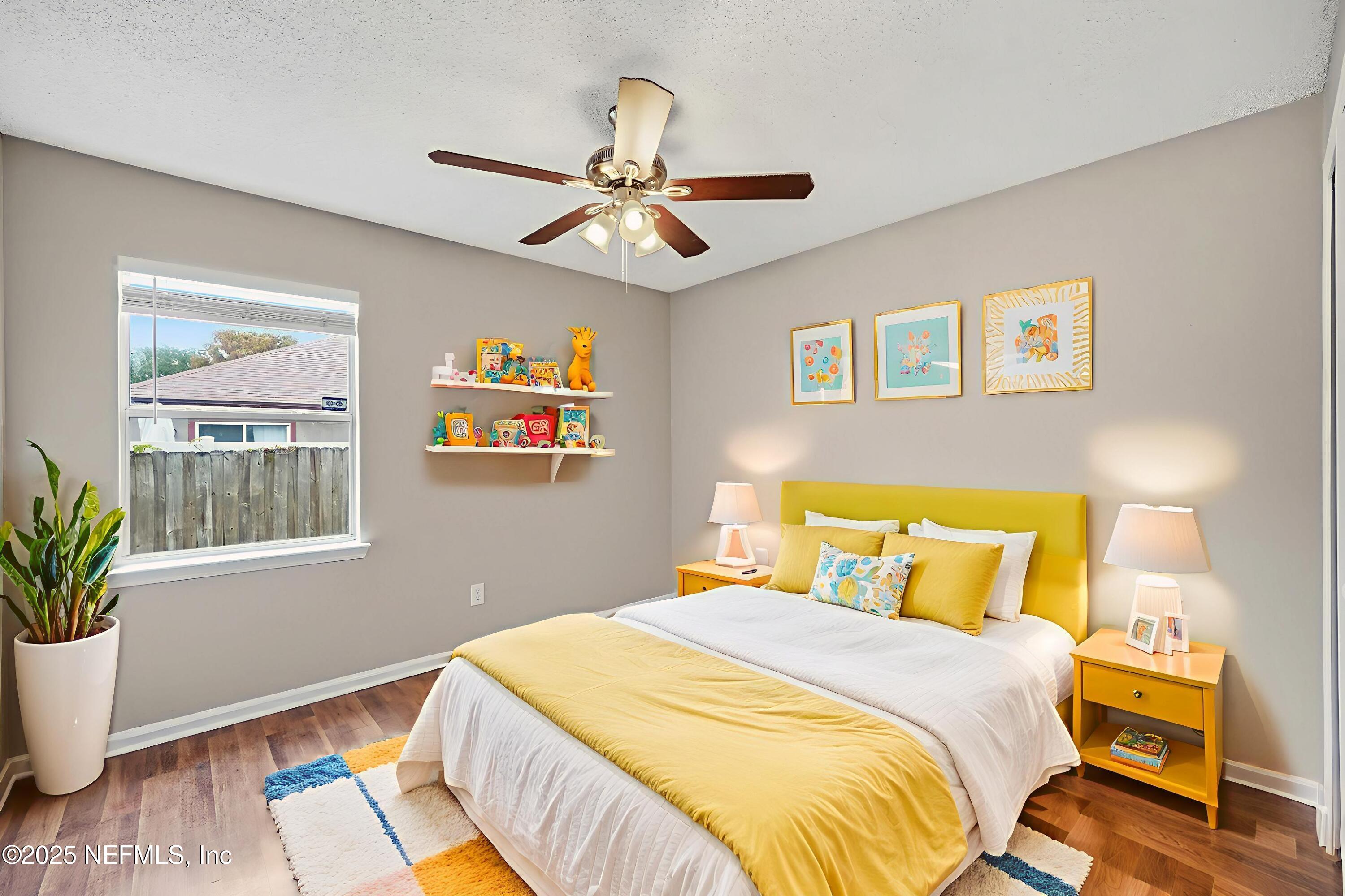 905 Gavagan Road Jacksonville, FL 32233 - Photo 16 of 21 a bedroom with a bed and wooden floor