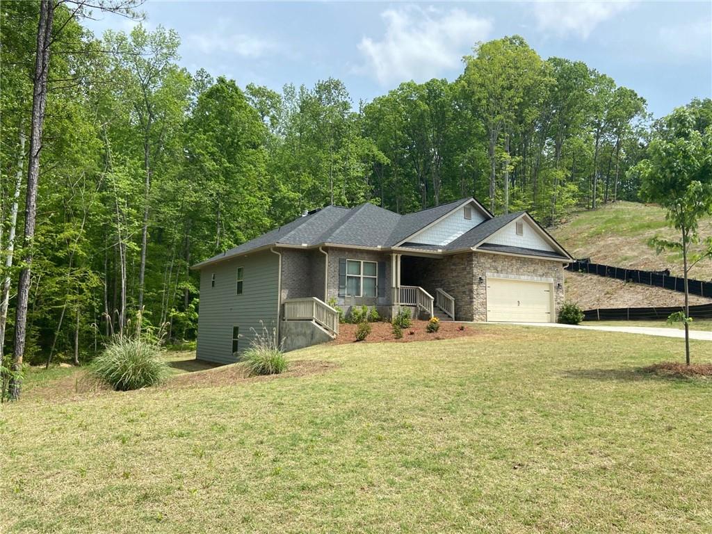 107 Lynn Top Ridge Dallas, GA 30157 - Photo 1 of 1 a front view of a house with a yard