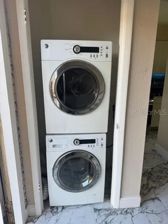 a utility room with dryer and washer