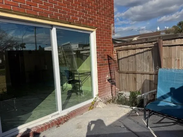 a view of a swimming pool with a table and chairs