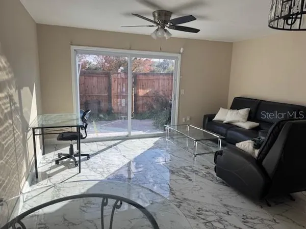 a living room with furniture and a window