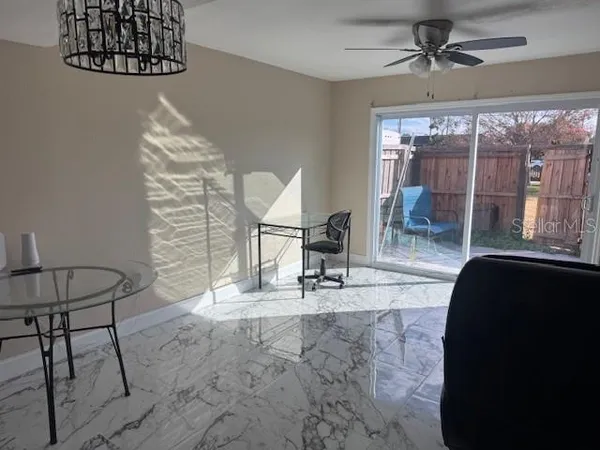 a view of a livingroom with furniture and a rug