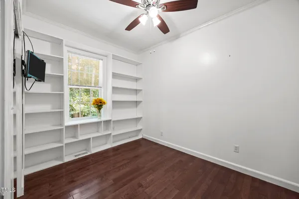 a view of a hallway with wooden floor and entryway