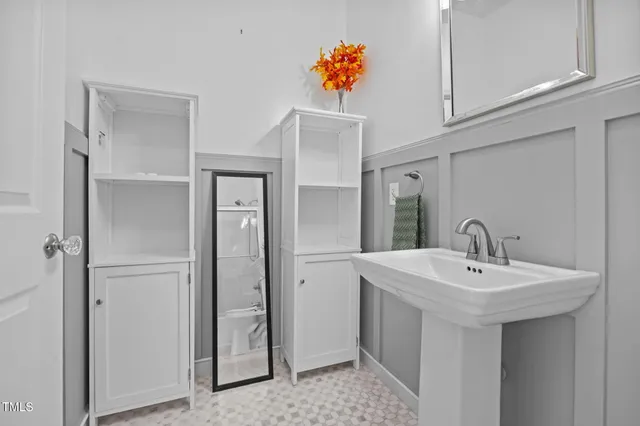 a bathroom with a sink and a mirror