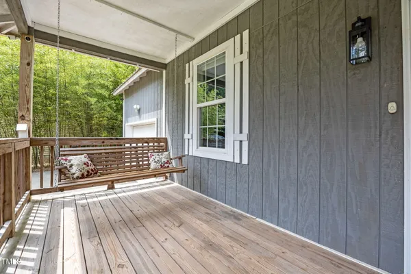 a view of a deck with wooden floor and outdoor space