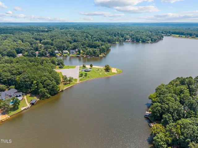 an aerial view of a house with a lake view