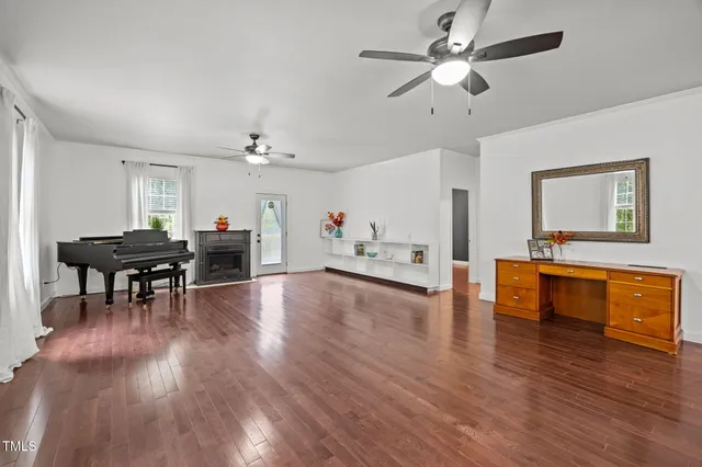 a view of a livingroom with furniture and a kitchen area