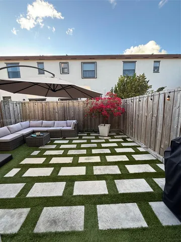 a view of swimming pool with a patio