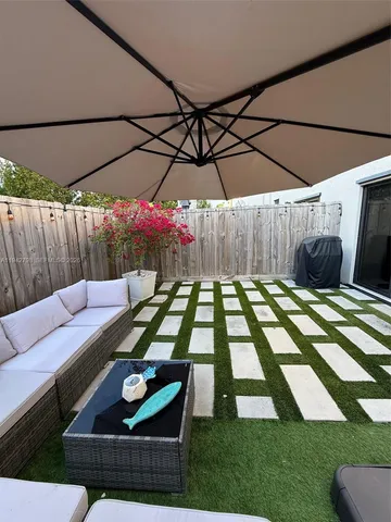 a view of yard with patio