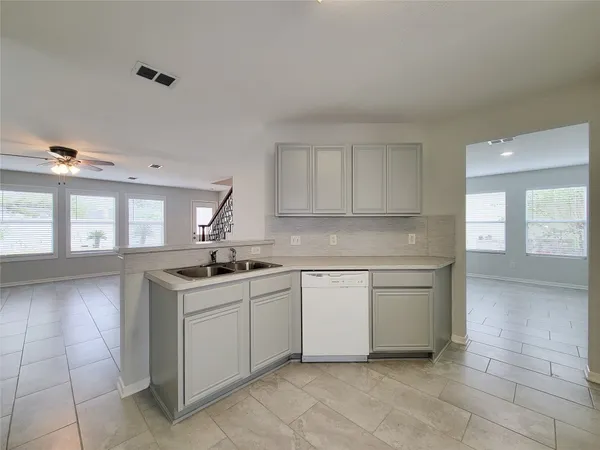 a kitchen with a sink and cabinets