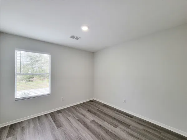 a view of a livingroom with wooden floor