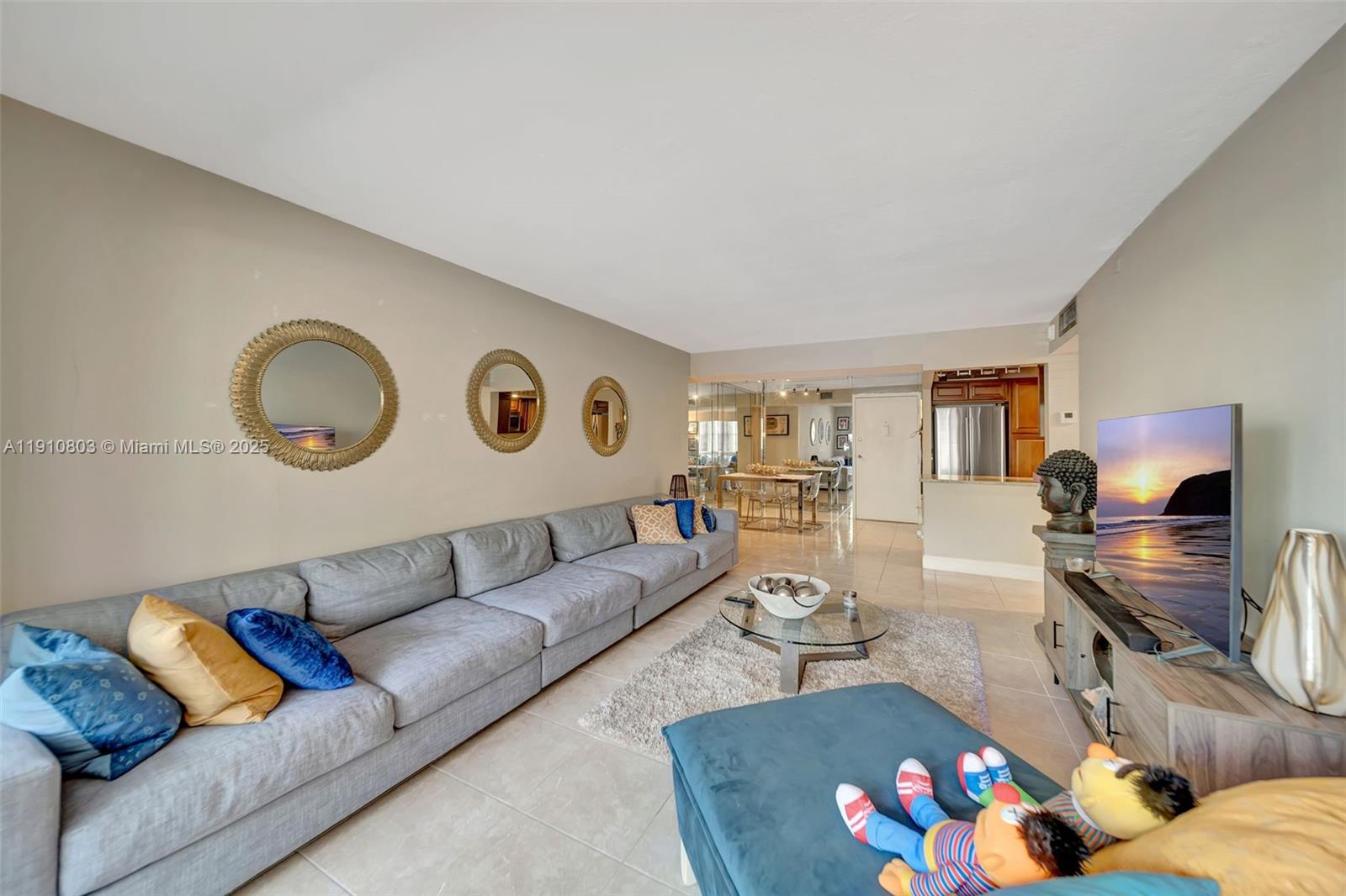 6700 Cypress Road, Unit 105 Plantation, FL 33317 - Photo 15 of 28 a living room with furniture and a flat screen tv