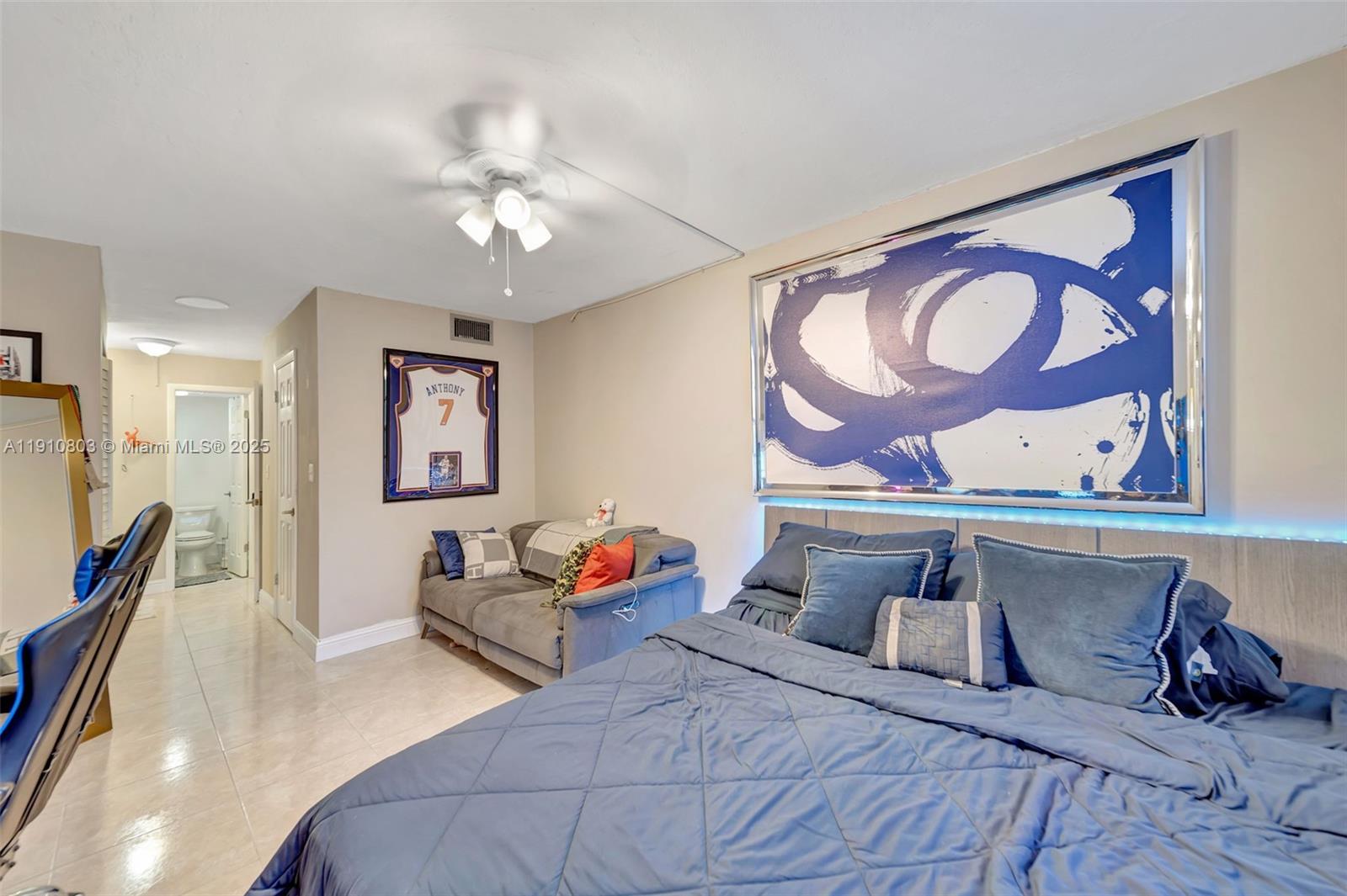 6700 Cypress Road, Unit 105 Plantation, FL 33317 - Photo 19 of 28 a bedroom with a bed and a painting on the wall