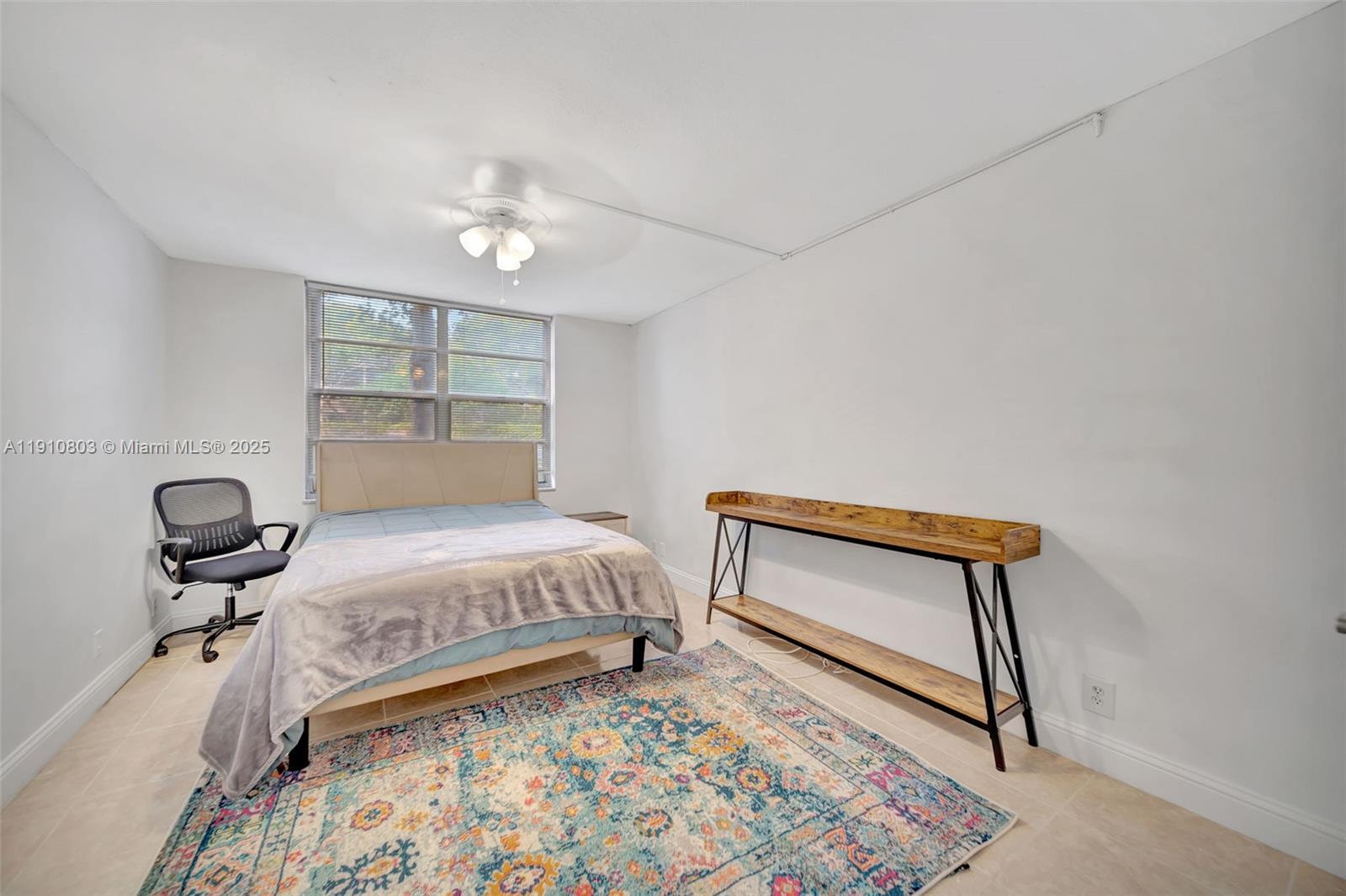 6700 Cypress Road, Unit 105 Plantation, FL 33317 - Photo 24 of 28 a bedroom with a bed and a dresser