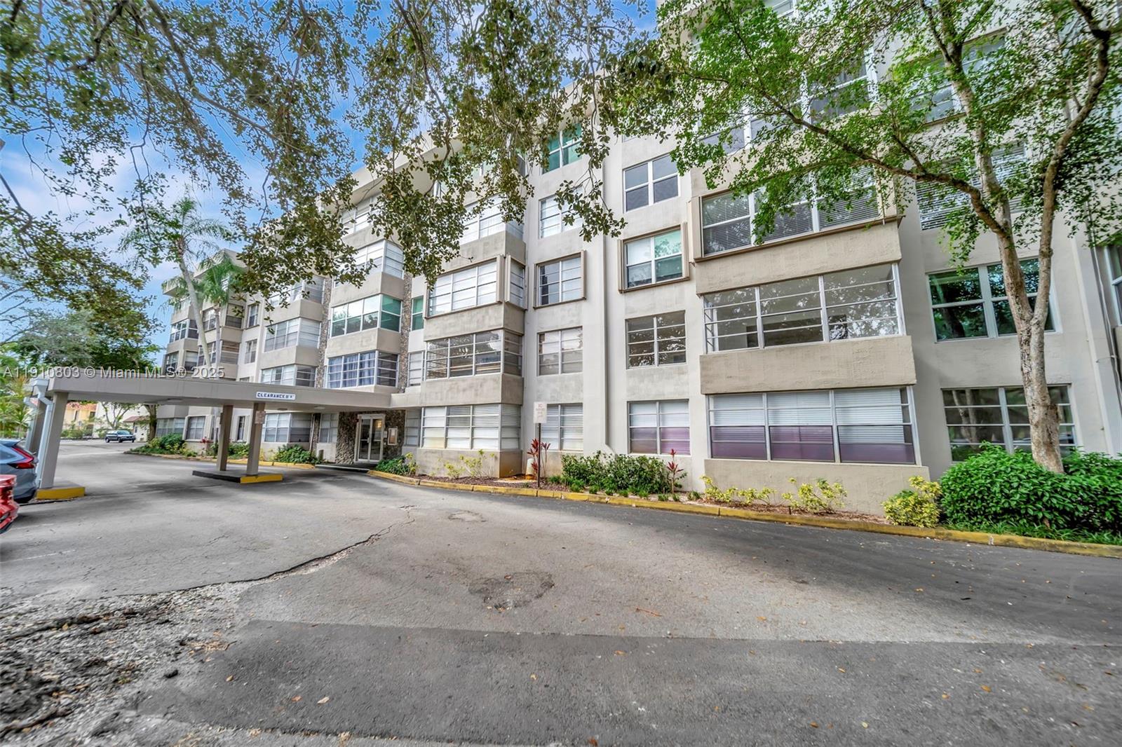 6700 Cypress Road, Unit 105 Plantation, FL 33317 - Photo 3 of 28 a city street lined with buildings and trees