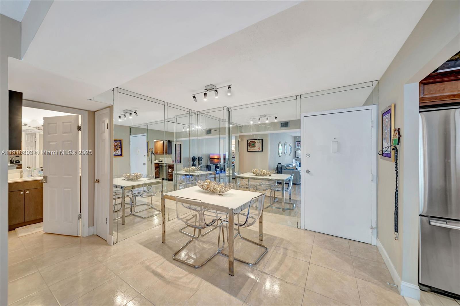 6700 Cypress Road, Unit 105 Plantation, FL 33317 - Photo 8 of 28 a view of a kitchen with dining area refrigerator and dining table