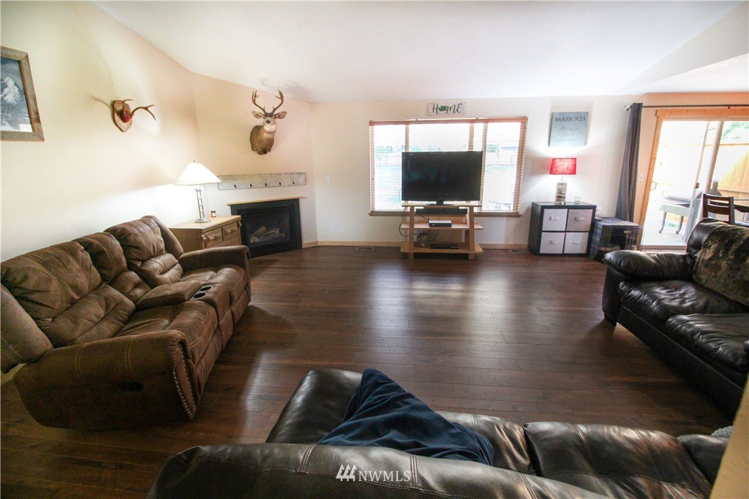 5432 188th Avenue Southwest Rochester, WA 98579 - Photo 3 of 31 a living room with furniture and a flat screen tv