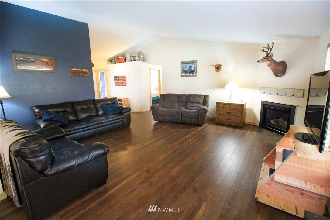 5432 188th Avenue Southwest Rochester, WA 98579 - Photo 4 of 31 a living room with furniture and a wooden floor