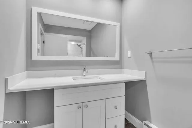 a bathroom with a sink and a mirror