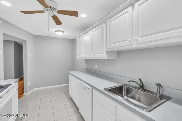 a kitchen that has a sink and dishwasher
