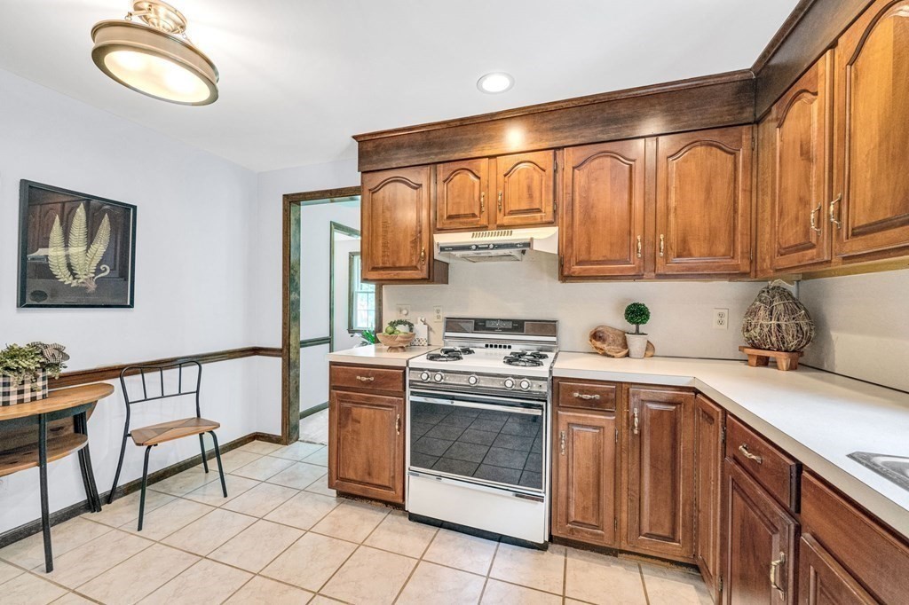 867 Shaker Road Longmeadow, MA 01106 - Photo 13 of 34 a kitchen with a stove cabinets and a sink