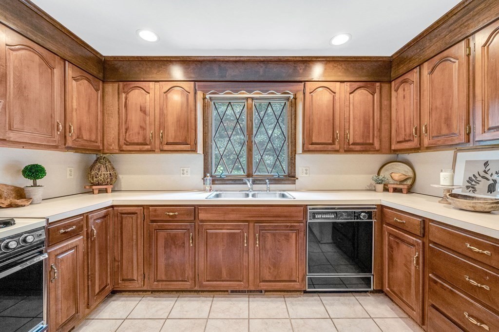 867 Shaker Road Longmeadow, MA 01106 - Photo 14 of 34 a kitchen with a sink stove top oven and cabinets