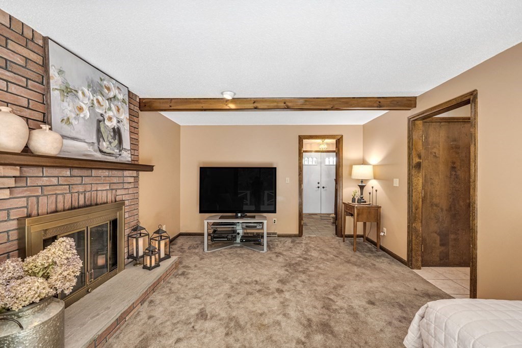 867 Shaker Road Longmeadow, MA 01106 - Photo 16 of 34 a living room with furniture and a fireplace