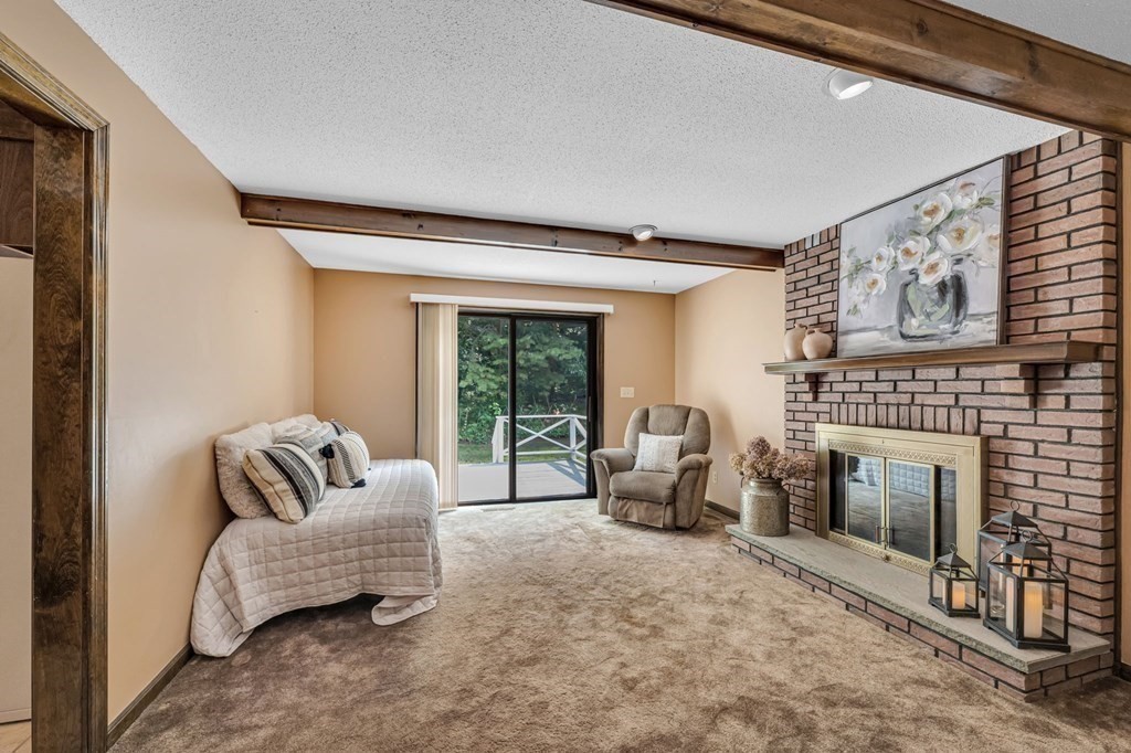 867 Shaker Road Longmeadow, MA 01106 - Photo 17 of 34 a living room with furniture and a fireplace