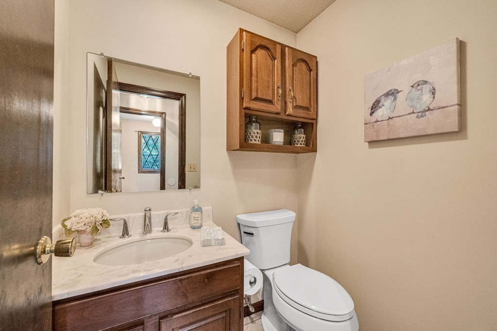 867 Shaker Road Longmeadow, MA 01106 - Photo 19 of 34 a bathroom with a sink vanity mirror and toilet