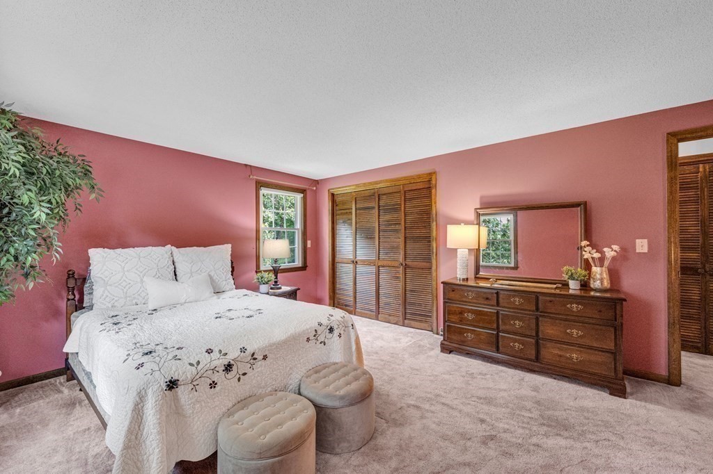 867 Shaker Road Longmeadow, MA 01106 - Photo 21 of 34 a bedroom with a bed and a dresser