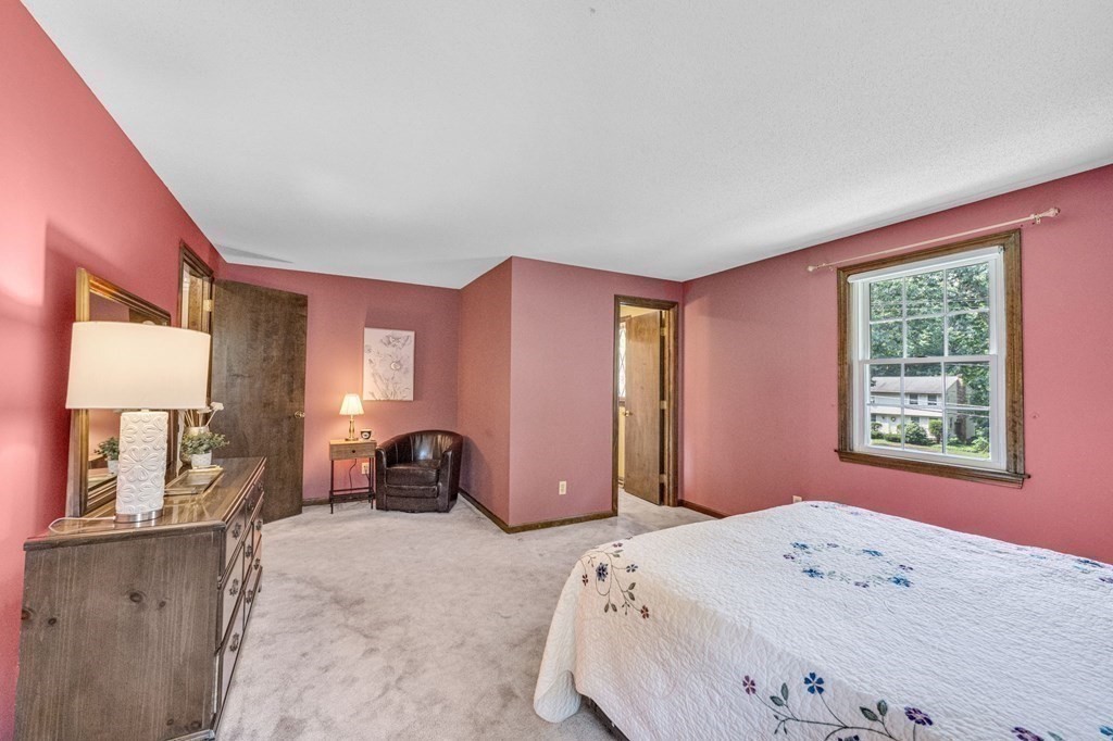 867 Shaker Road Longmeadow, MA 01106 - Photo 22 of 34 a bedroom with a bed and wooden floor