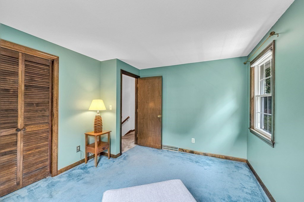 867 Shaker Road Longmeadow, MA 01106 - Photo 25 of 34 a view of an empty room with a fireplace