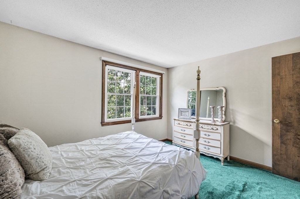 867 Shaker Road Longmeadow, MA 01106 - Photo 27 of 34 a bedroom with a bed dresser and a window