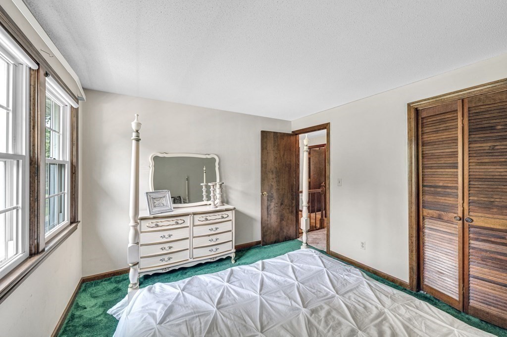 867 Shaker Road Longmeadow, MA 01106 - Photo 28 of 34 a bedroom with a bed and a window