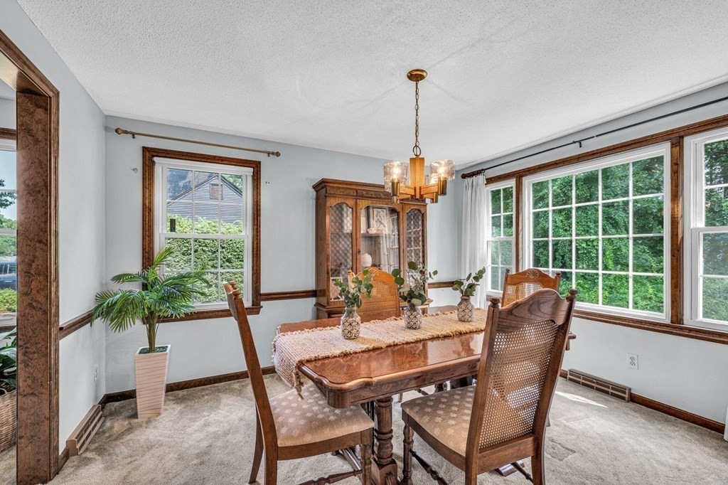 867 Shaker Road Longmeadow, MA 01106 - Photo 8 of 34 a view of a dining room with furniture window and wooden floor