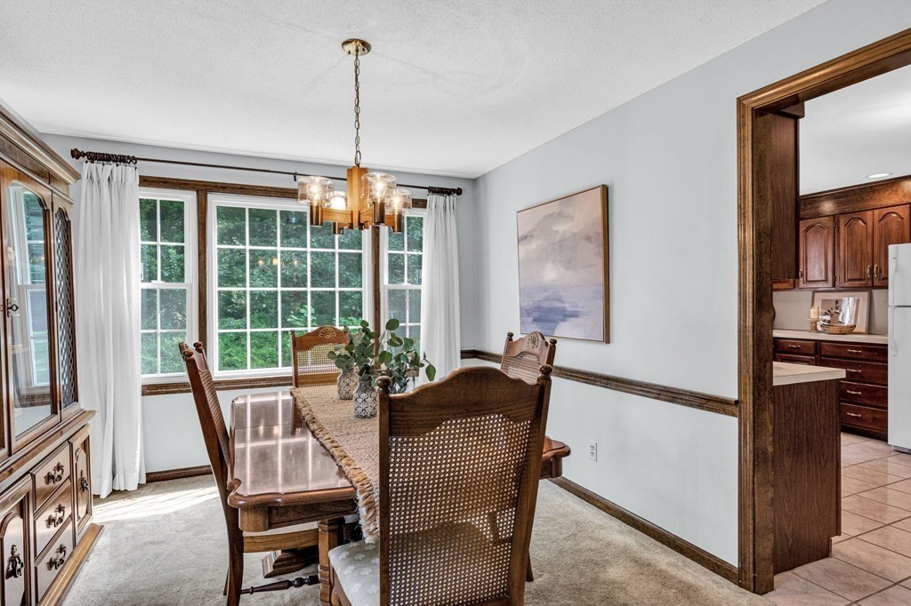867 Shaker Road Longmeadow, MA 01106 - Photo 10 of 34 a view of a dining room with furniture window and outside view