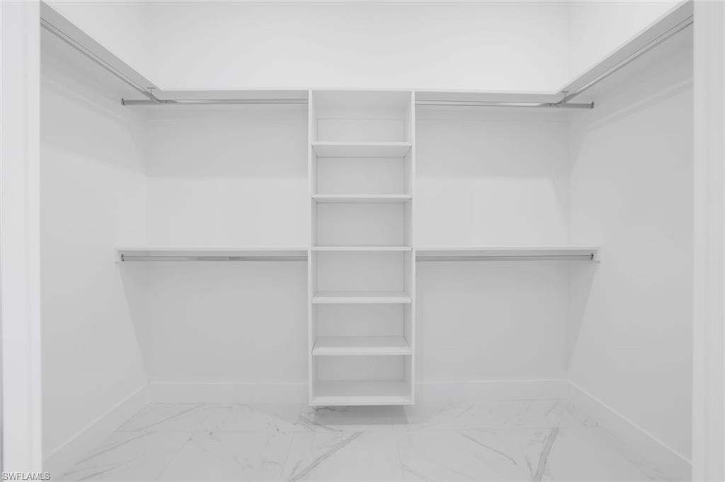 1068 16th Street Northeast Naples, FL 34120 - Photo 12 of 35 a view of an empty walk in closet