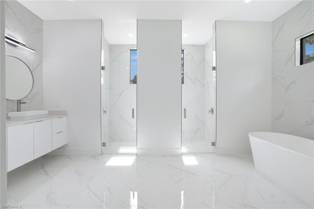1068 16th Street Northeast Naples, FL 34120 - Photo 13 of 35 a bathroom with a toilet sink and shower