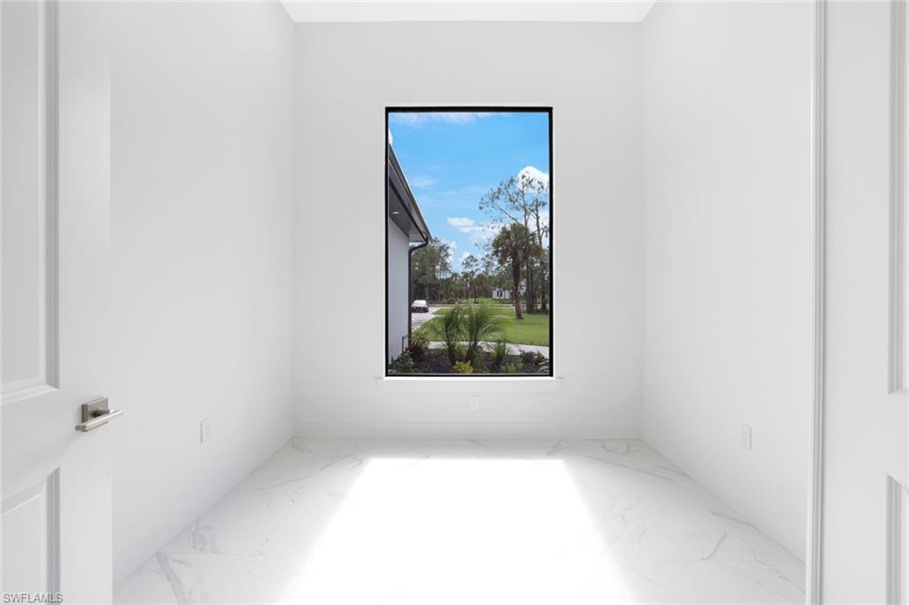 1068 16th Street Northeast Naples, FL 34120 - Photo 22 of 35 a view of a small space with a window