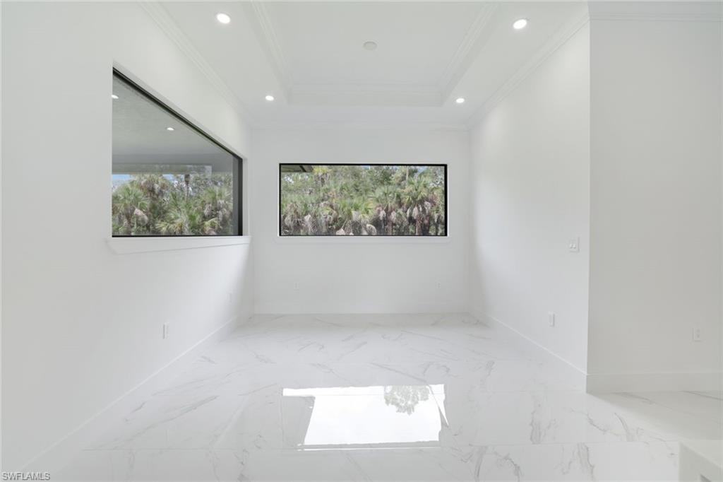 1068 16th Street Northeast Naples, FL 34120 - Photo 25 of 35 an empty room with windows